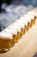 Close-up of beer glasses on the counter