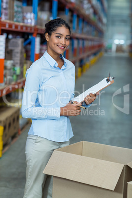 Portrait of happy manager is posing and smiling during work