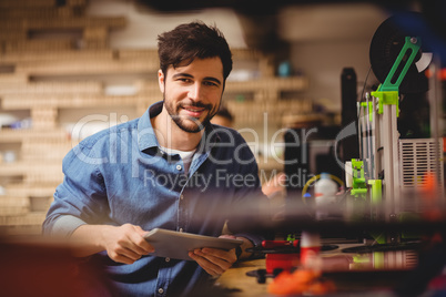 Graphic designer holding digital tablet