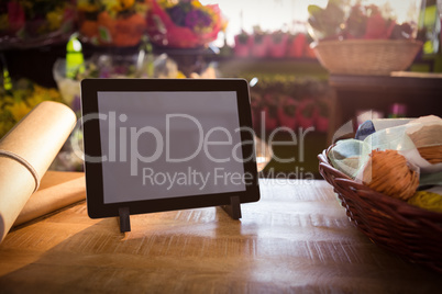 Wicker basket and digital tablet on the wooden table
