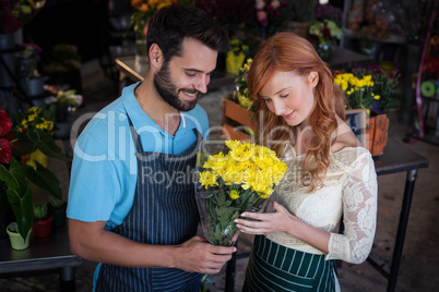 Couple holding flower bouquet