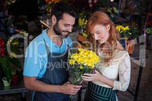 Couple holding flower bouquet