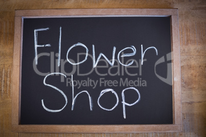 Close-up of slate with flower shop sign