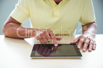 Senior man using a digital tablet