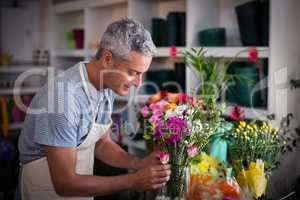 Florist preparing a flower bouquet