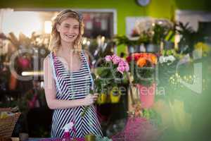 Female florist preparing flower bouquet