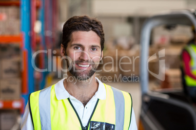 Portrait of happy worker is posing face to the camera