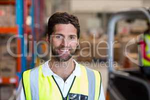 Portrait of happy worker is posing face to the camera