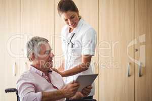 Senior using a tablet in a wheelchair