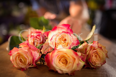 Bunch of pink roses on table