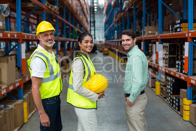 Portrait of manager and workers are standing and smiling to the