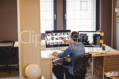 Graphic designer working at his desk