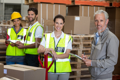 Portrait of workers and manager are smiling and posing face to c