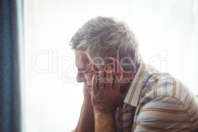 Sad senior man sitting