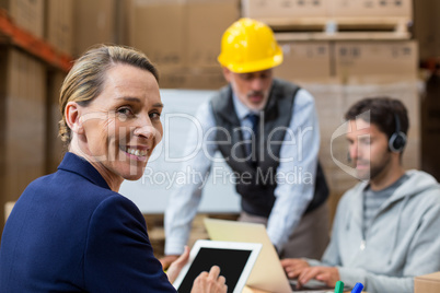 Smiling workers looking at camera