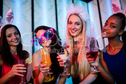 Group of women posing with glass of cocktail