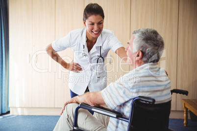 Happy nurse smiling to his patient