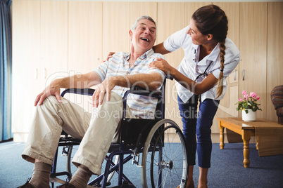 Happy nurse smiling to his patient