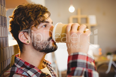 Graphic designer drinking cup of coffee