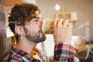 Graphic designer drinking cup of coffee