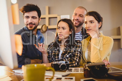 Team of graphic designers working on a computer