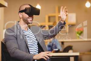 Male graphic designer wearing virtual glasses