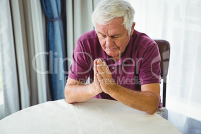 Senior man praying