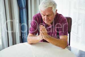 Senior man praying