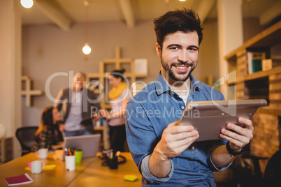 Graphic designer holding digital tablet