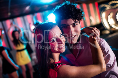 Cute couple dancing together on dance floor