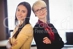 Portrait of graphic designers standing with arms crossed