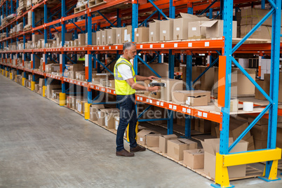 View of worker is checking cardboard boxes