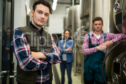 Brewers posing at brewery factory