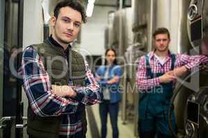 Brewers posing at brewery factory