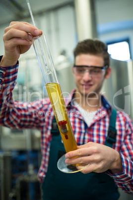 Brewer testing beer