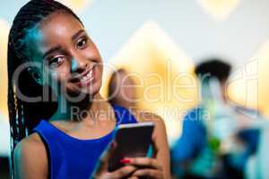 Beautiful smiling woman using mobile phone