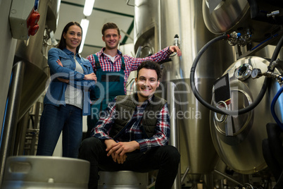 Brewers posing at brewery factory