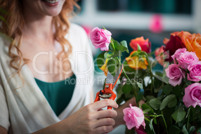 Female florist preparing flower bouquet