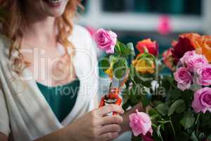 Female florist preparing flower bouquet