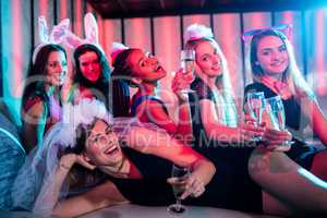 Group of women posing with glass of champagne