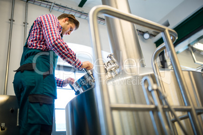 Maintenance worker working at brewery