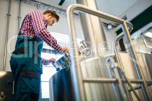 Maintenance worker working at brewery