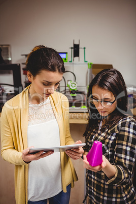 Graphic designers interacting using digital tablet