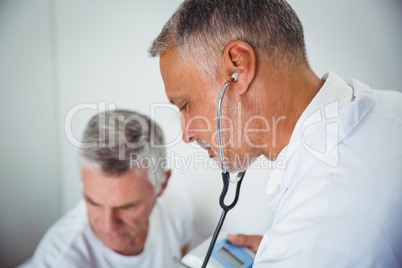 Doctor using stethoscope