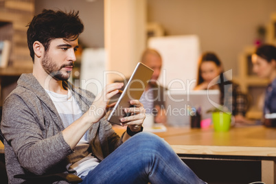 Male graphic designer using digital tablet