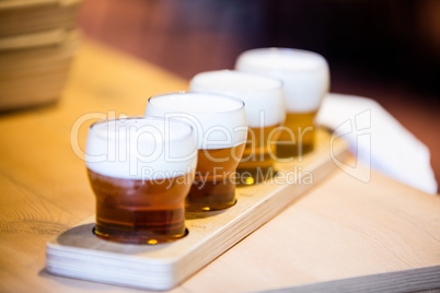 Close-up of beer glasses on the counter