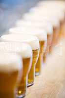 Close-up of beer glasses on the counter