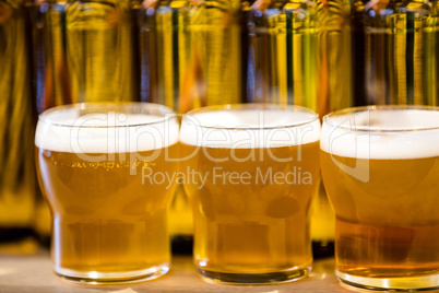 Close-up of beer glasses on the counter