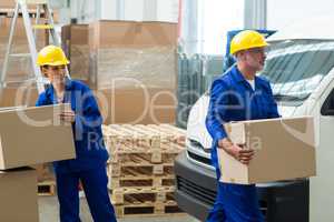 Workers carrying boxes