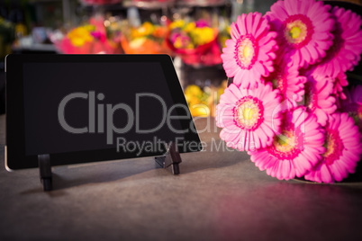 Digital tablet with pink sunflower